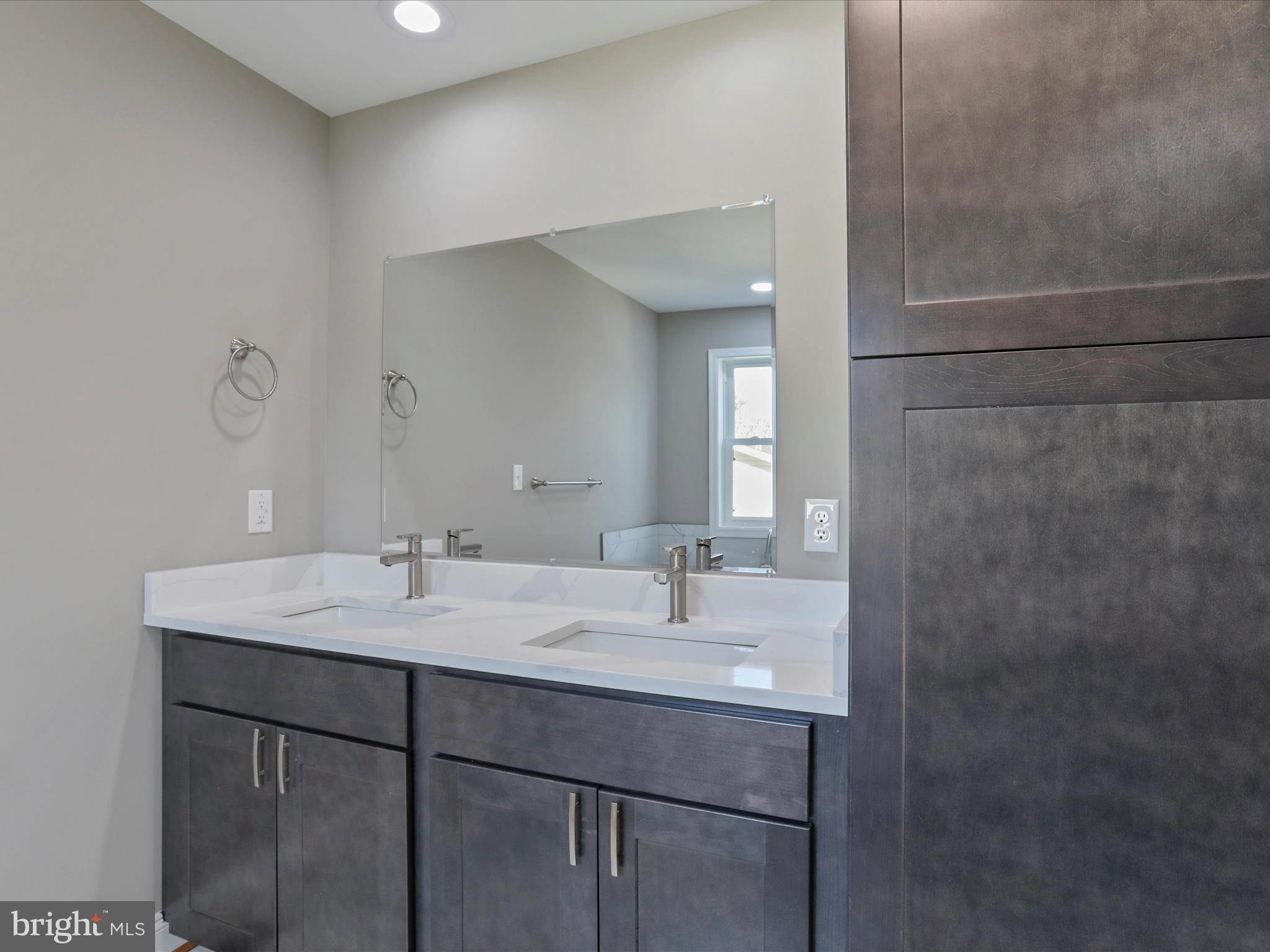 628 Black Bear Road Maurertown, VA 22644 - Photo 32 of 67 a bathroom with a sink and a mirror
