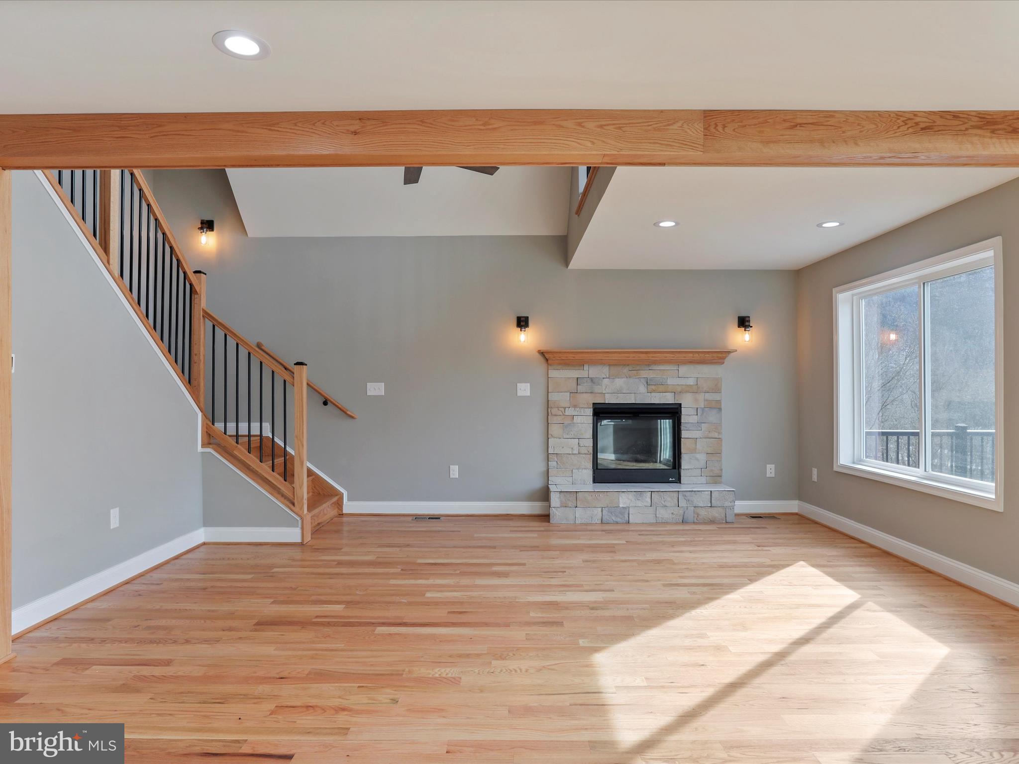 628 Black Bear Road Maurertown, VA 22644 - Photo 42 of 67 a view of an empty room with wooden floor and a window