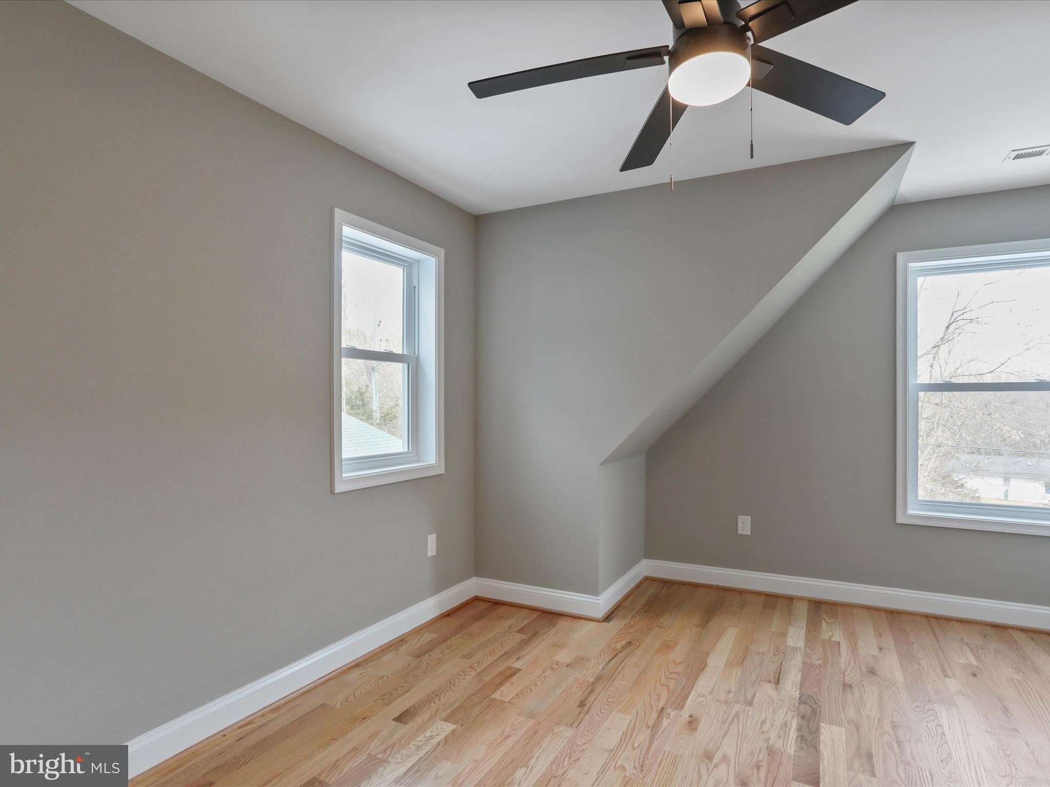 628 Black Bear Road Maurertown, VA 22644 - Photo 50 of 67 a view of an empty room with wooden floor and a window