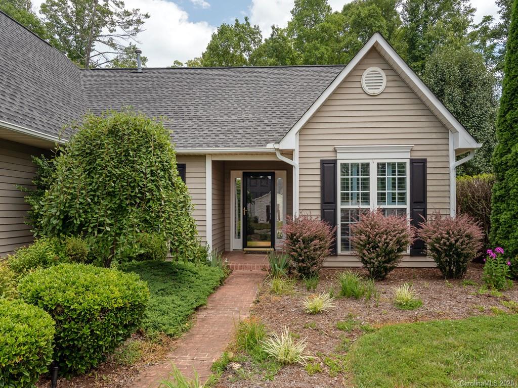 86 Stonehollow Road Fletcher, NC 28732 - Photo 2 of 23 a front view of a house with sitting area and garden