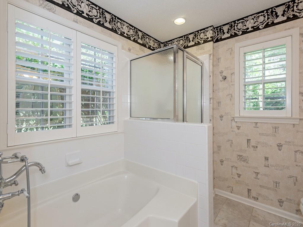 86 Stonehollow Road Fletcher, NC 28732 - Photo 16 of 23 a bathroom with a shower and a bathtub