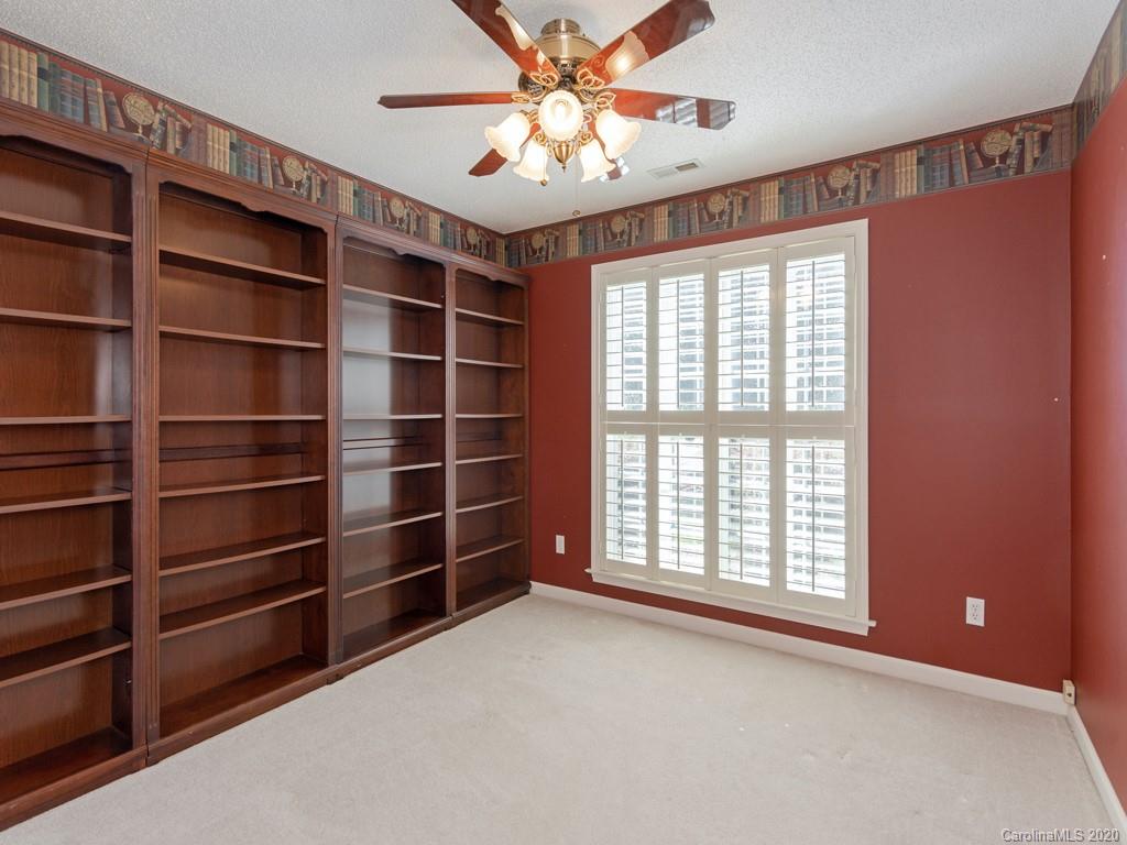 86 Stonehollow Road Fletcher, NC 28732 - Photo 17 of 23 a view of an empty room with a window and a ceiling fan