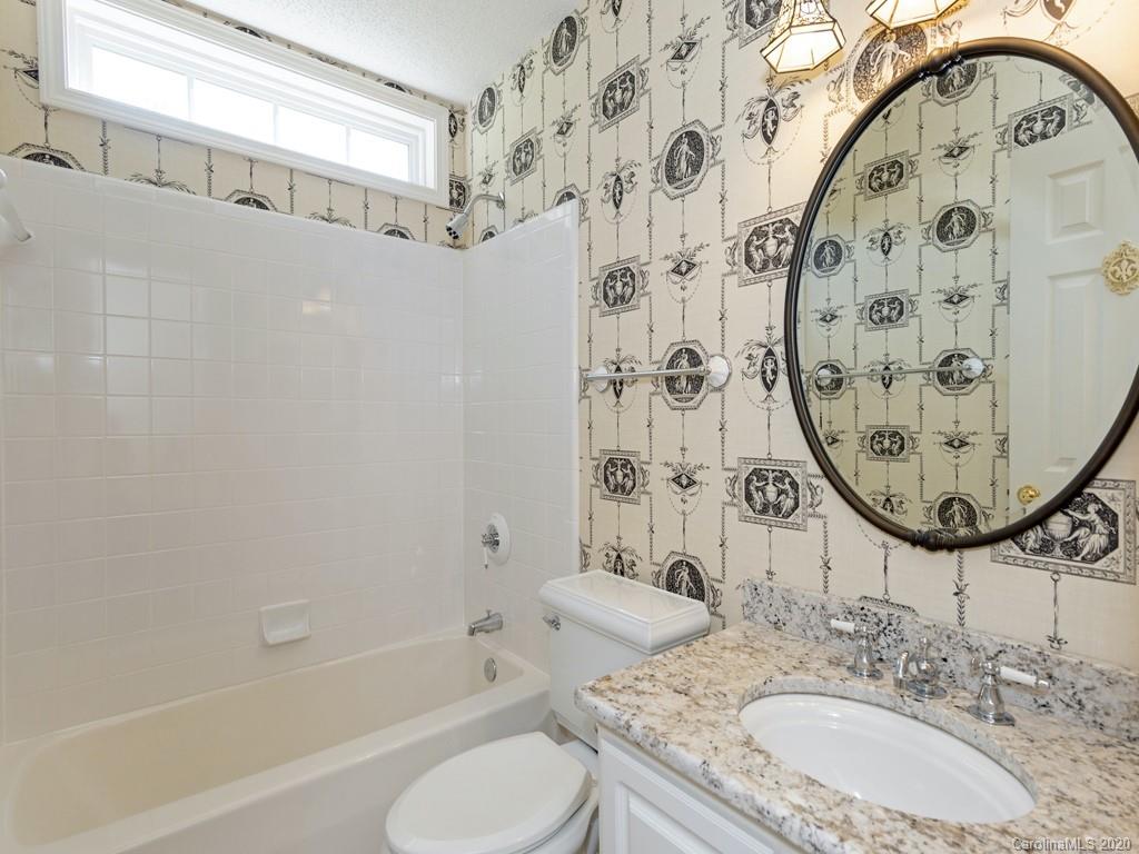 86 Stonehollow Road Fletcher, NC 28732 - Photo 18 of 23 a bathroom with a granite countertop sink toilet and shower