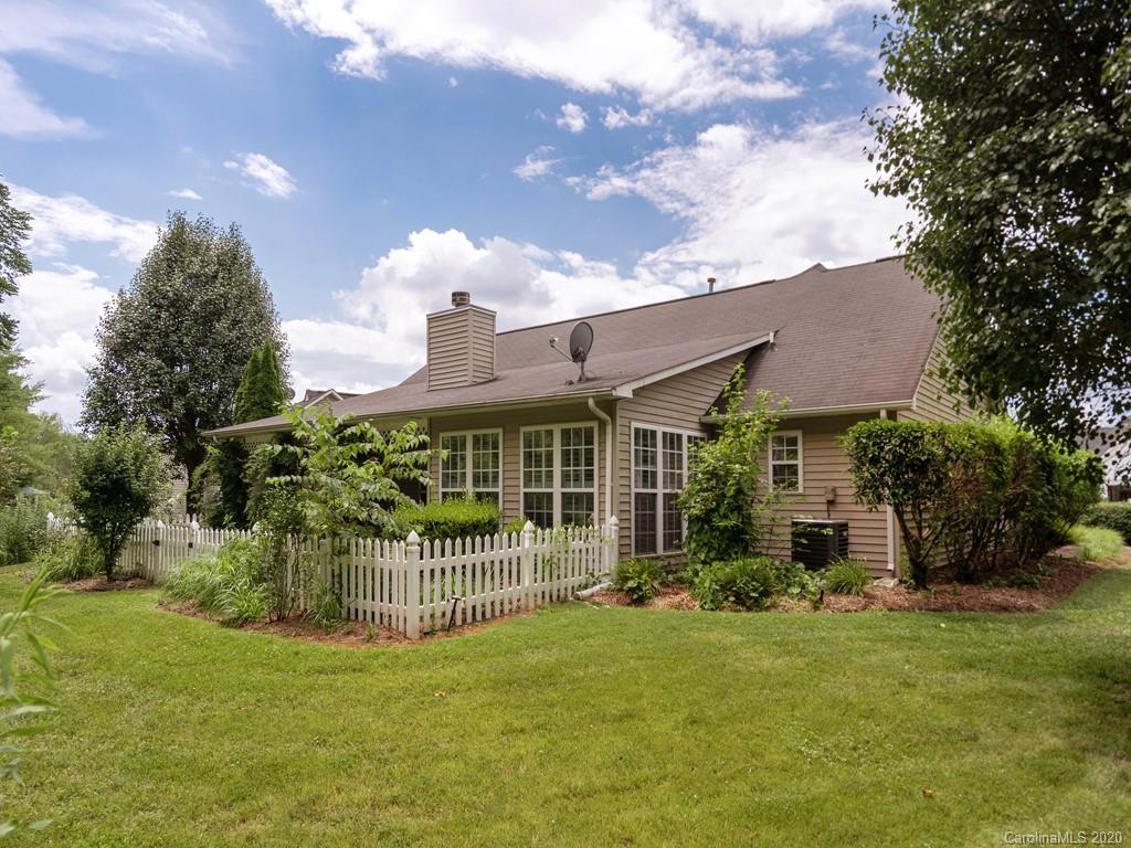 86 Stonehollow Road Fletcher, NC 28732 - Photo 23 of 23 a view of a house with a yard and a garden