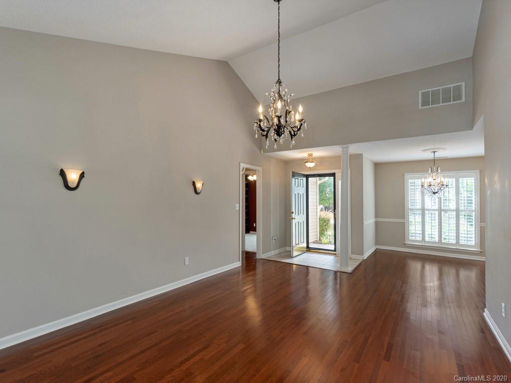 86 Stonehollow Road Fletcher, NC 28732 - Photo 4 of 23 a view of an empty room with wooden floor and a window