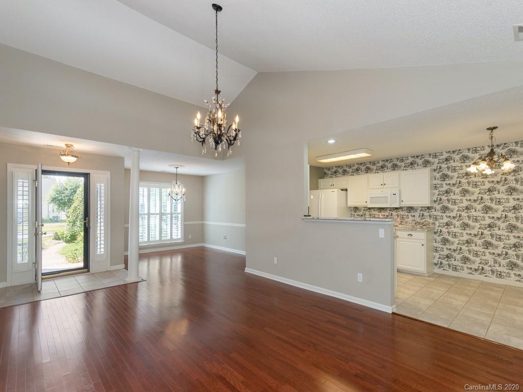 86 Stonehollow Road Fletcher, NC 28732 - Photo 6 of 23 a view of an empty room with wooden floor and a window