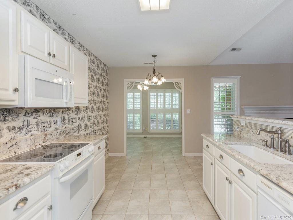 86 Stonehollow Road Fletcher, NC 28732 - Photo 9 of 23 a bathroom with a sink double vanity granite tub and shower