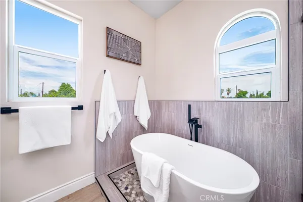 a bathroom with a toilet a sink and a mirror