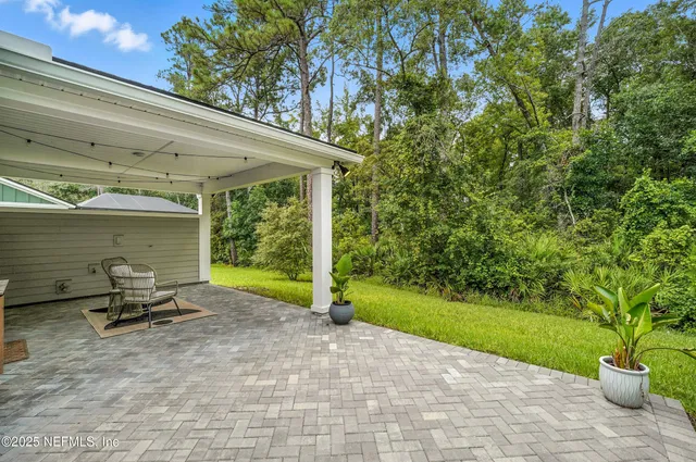 a view of a yard with a tree
