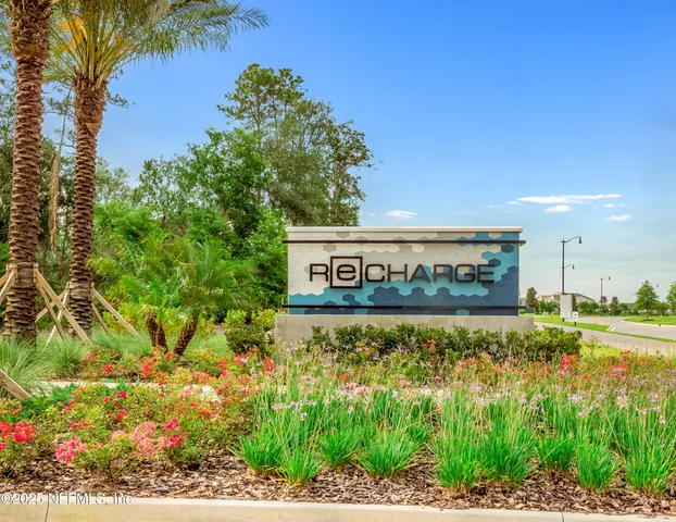 a view of a swimming pool and an outdoor seating