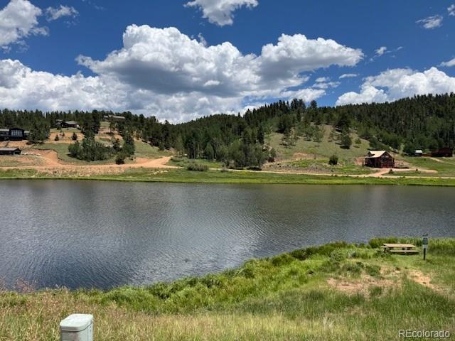 209 Kenosha Circle Divide, CO 80814 - Photo 17 of 17 a view of a lake with houses in the background