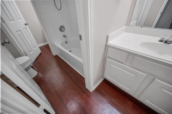 a bathroom with a bathtub and a sink