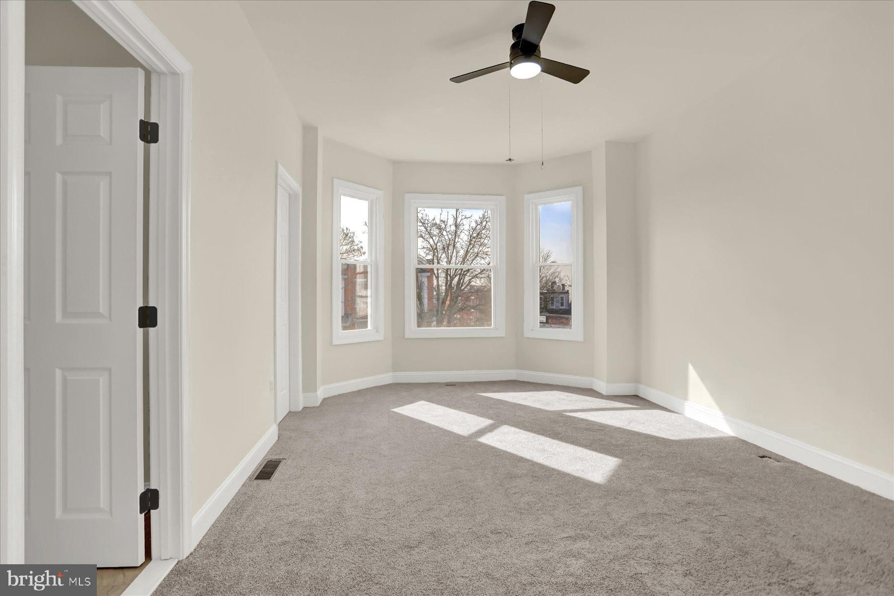 2920 Brighton Street Baltimore, MD 21216 - Photo 15 of 32 a view of an empty room with a window