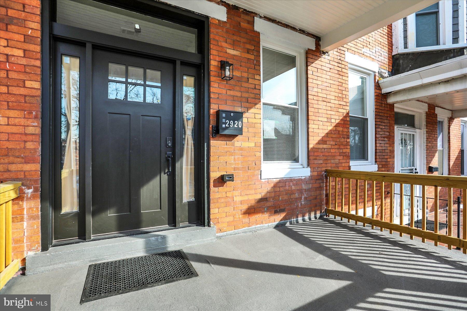 2920 Brighton Street Baltimore, MD 21216 - Photo 2 of 32 a view of a brick house with a large windows