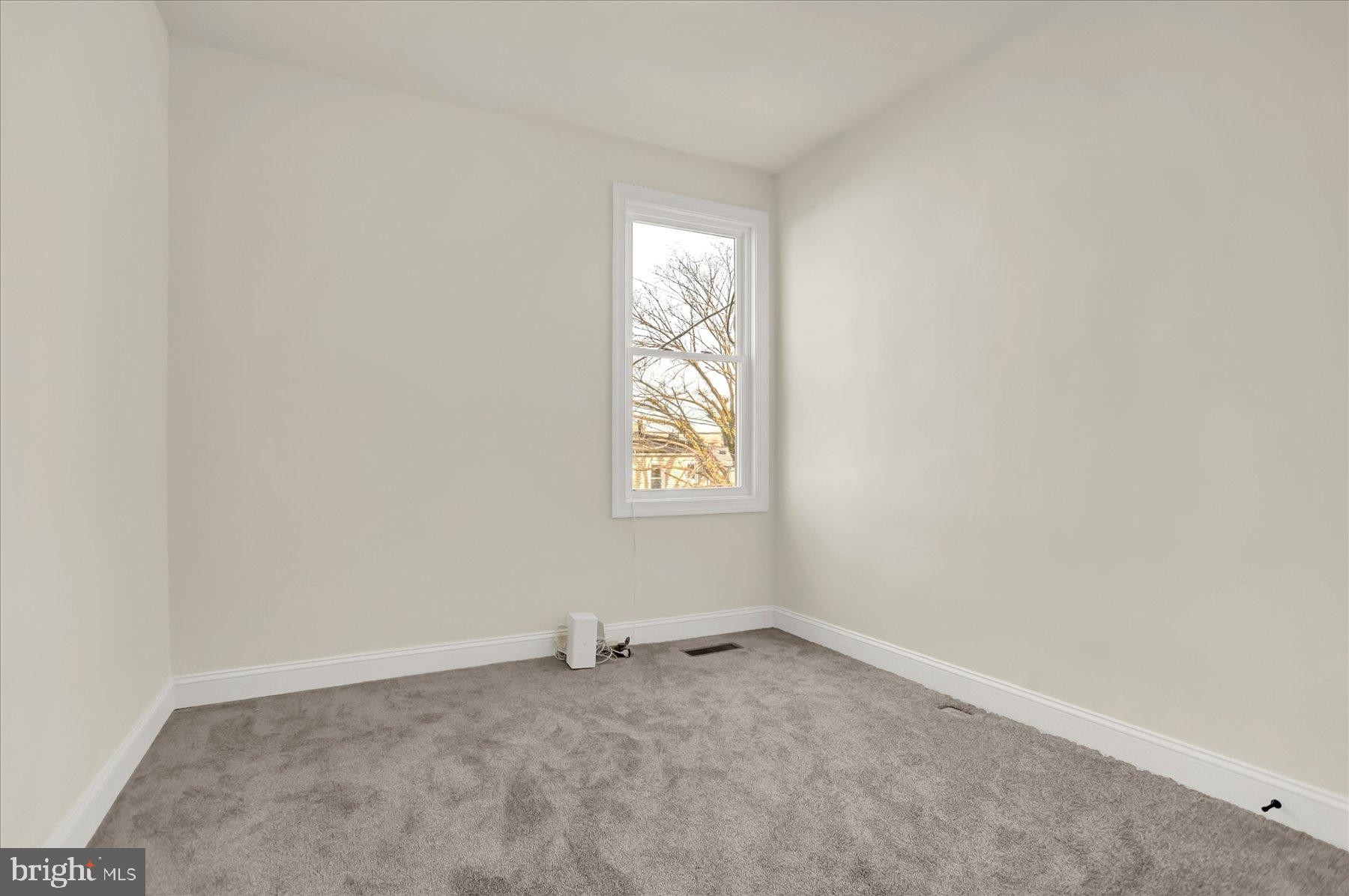 2920 Brighton Street Baltimore, MD 21216 - Photo 21 of 32 an empty room with windows