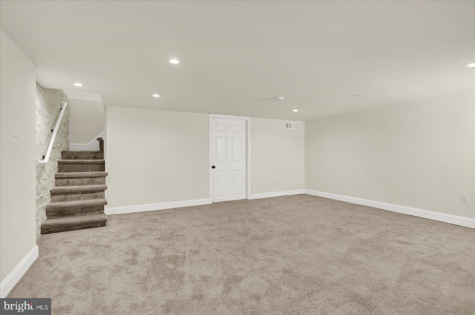2920 Brighton Street Baltimore, MD 21216 - Photo 25 of 32 a view of an empty room with stairs