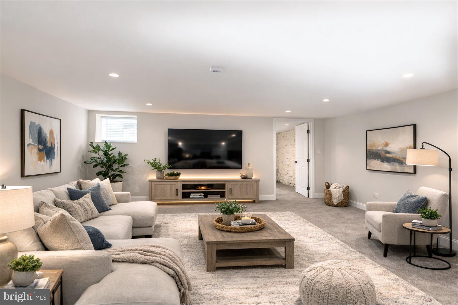 2920 Brighton Street Baltimore, MD 21216 - Photo 27 of 32 a living room with furniture and a flat screen tv