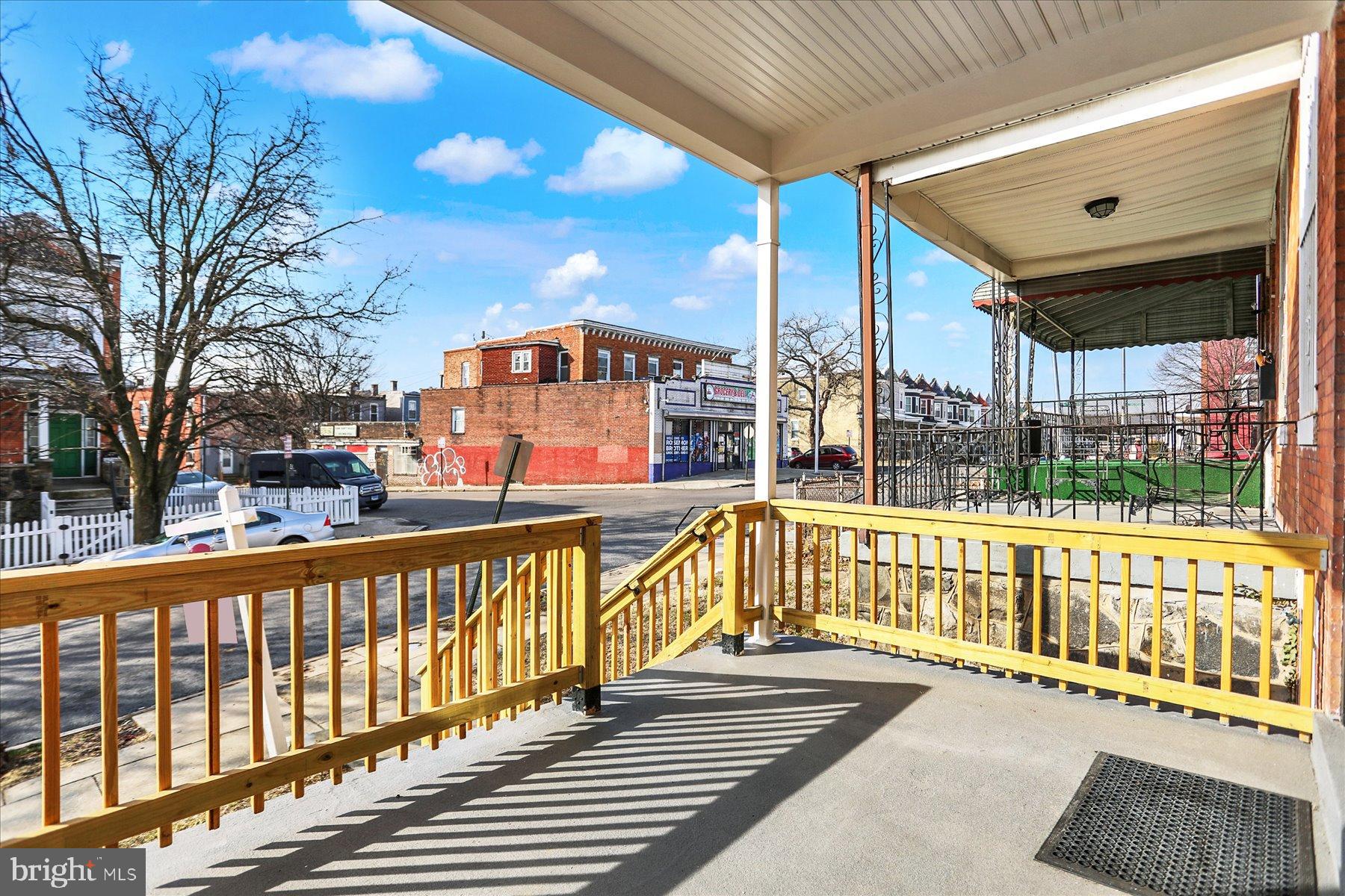 2920 Brighton Street Baltimore, MD 21216 - Photo 3 of 32 a view of a street with wooden stairs