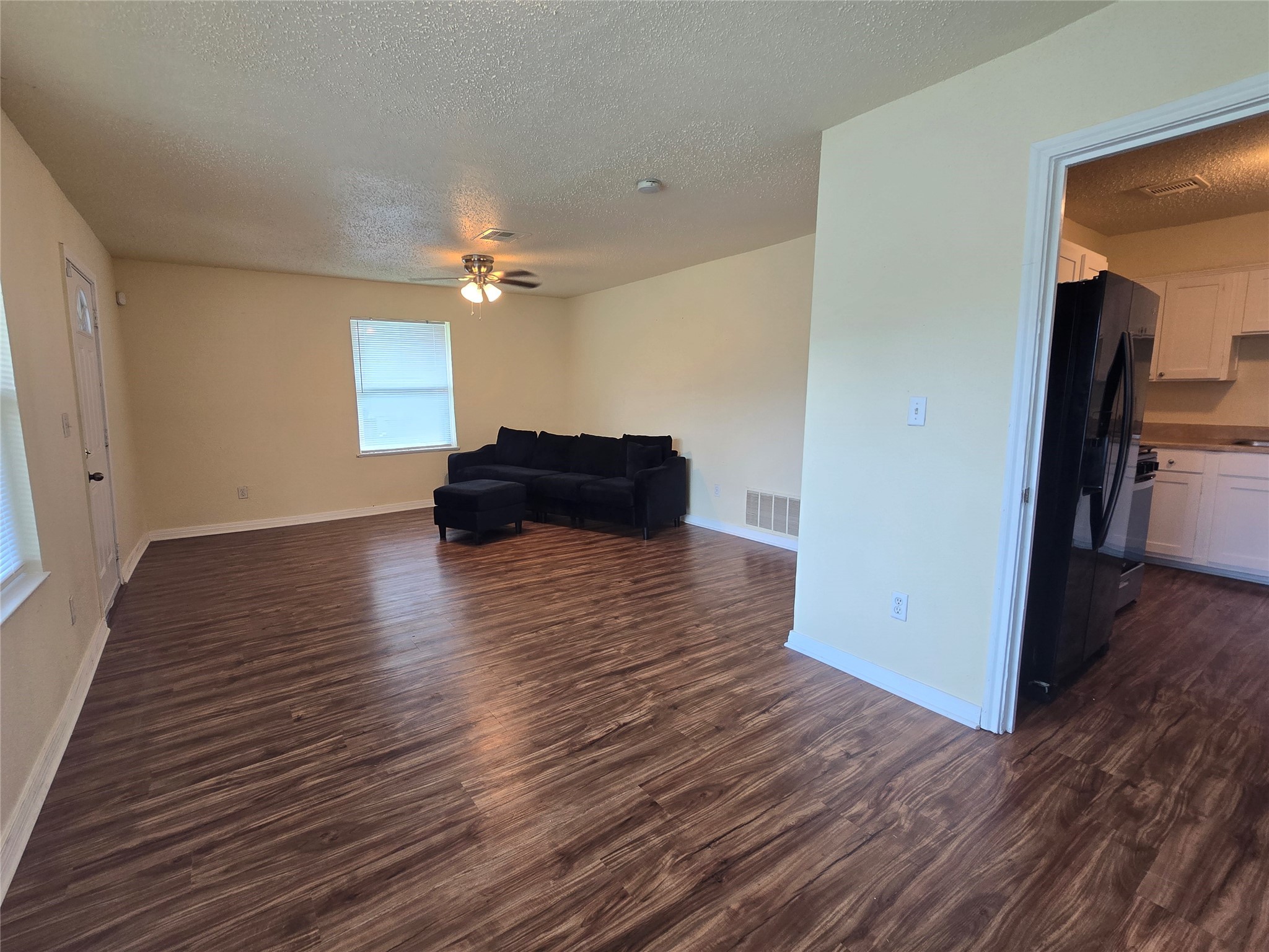 5218 Kelso Street Houston, TX 77021 - Photo 5 of 7 a view of a livingroom with wooden floor