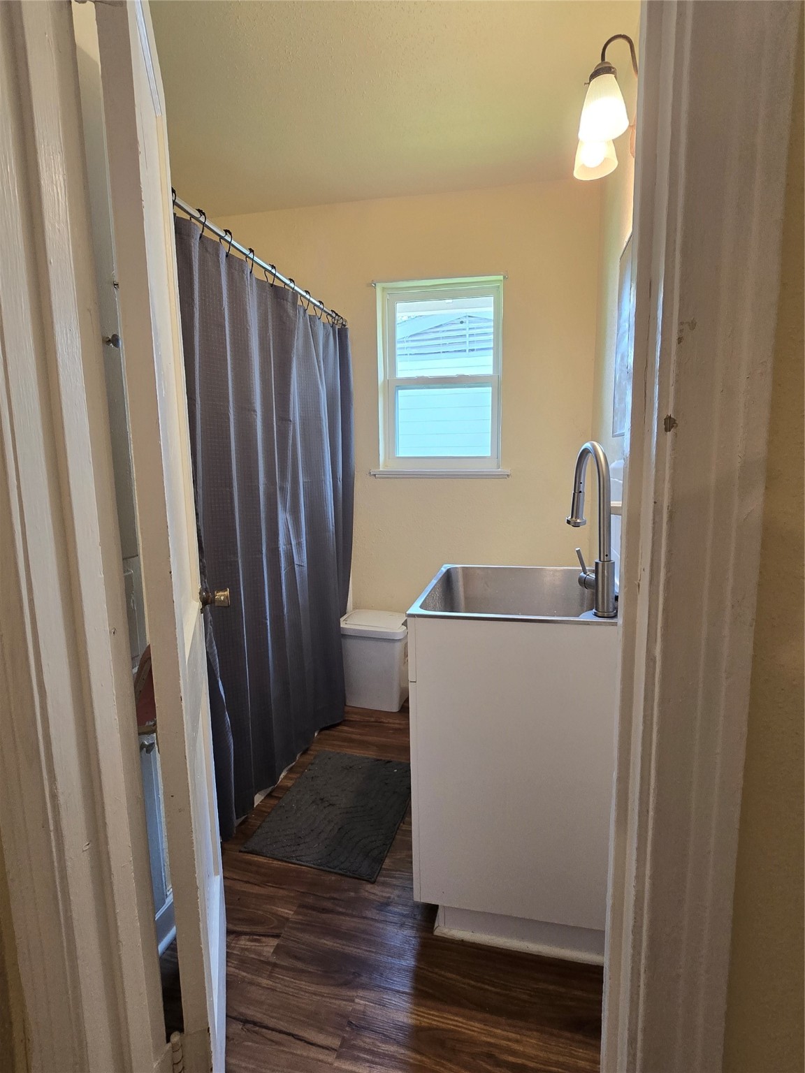 5218 Kelso Street Houston, TX 77021 - Photo 7 of 7 a bathroom with a sink a toilet a mirror and shower