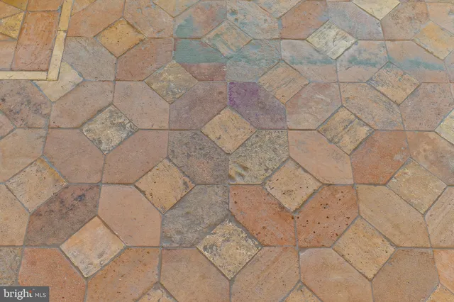 a bathroom with a bathtub sink and mirror
