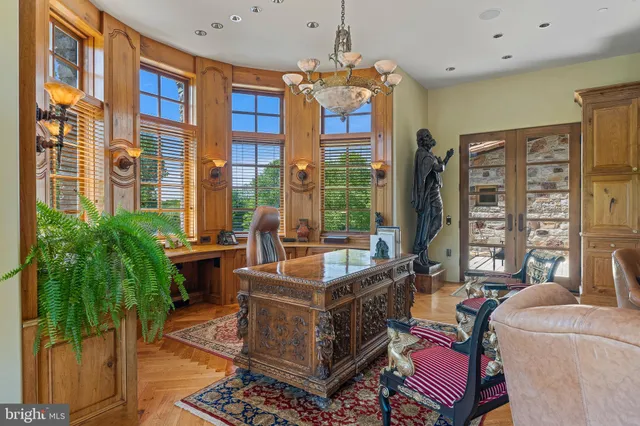 a living room with furniture ceiling fan and a rug