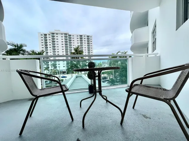a view of a balcony with chairs