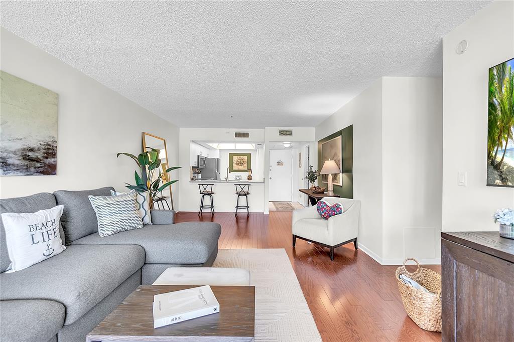 12200 Vonn Road, Unit 2206 Largo, FL 33774 - Photo 18 of 60 a living room with furniture and a couch