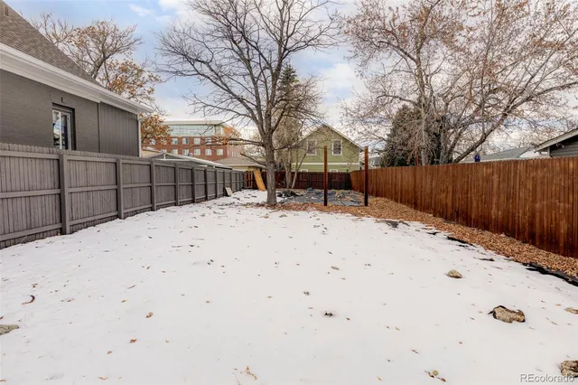 a view of snow on the side of house