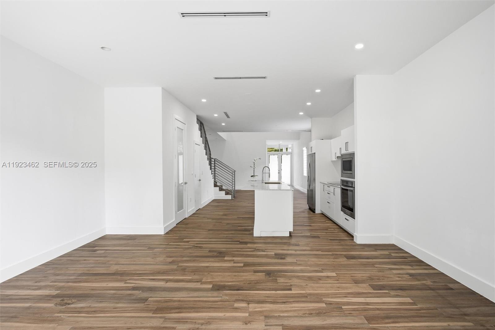 2852 Southwest 32nd Court, Unit 2852 Miami, FL 33133 - Photo 16 of 50 a view of a hallway with wooden floor