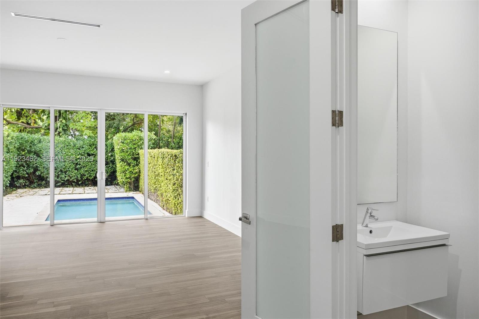 2852 Southwest 32nd Court, Unit 2852 Miami, FL 33133 - Photo 19 of 50 a view of an empty room with a window and tub