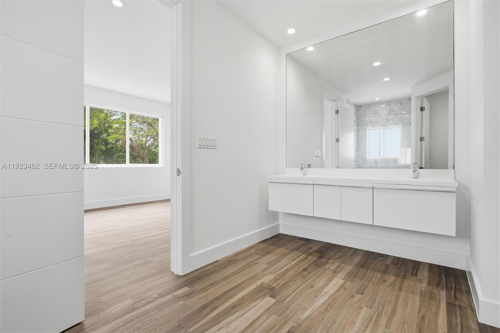 2852 Southwest 32nd Court, Unit 2852 Miami, FL 33133 - Photo 28 of 50 a bathroom with a sink and a mirror