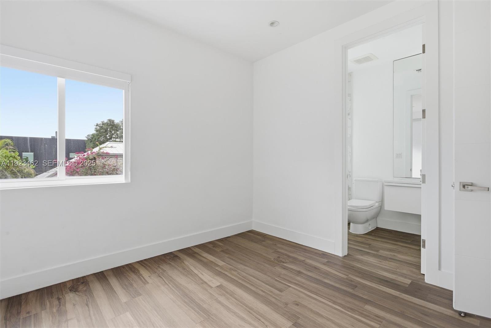 2852 Southwest 32nd Court, Unit 2852 Miami, FL 33133 - Photo 33 of 50 a view of a room with wooden floor and window
