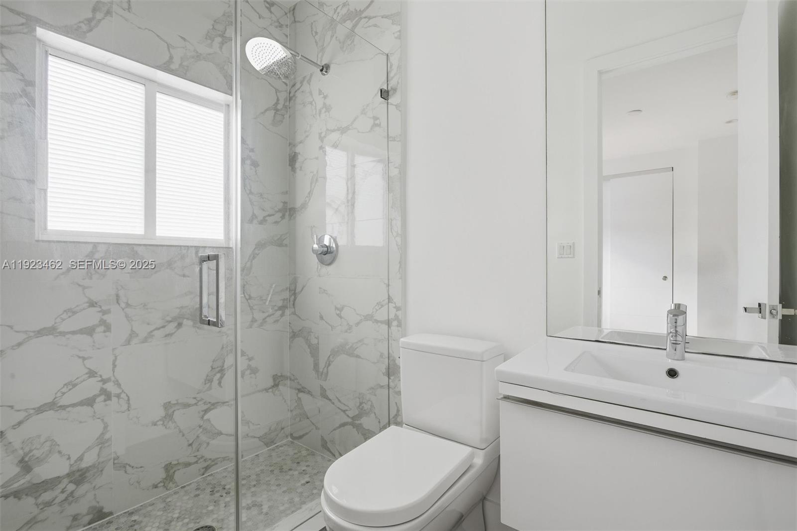 2852 Southwest 32nd Court, Unit 2852 Miami, FL 33133 - Photo 34 of 50 a bathroom with a sink a toilet and shower