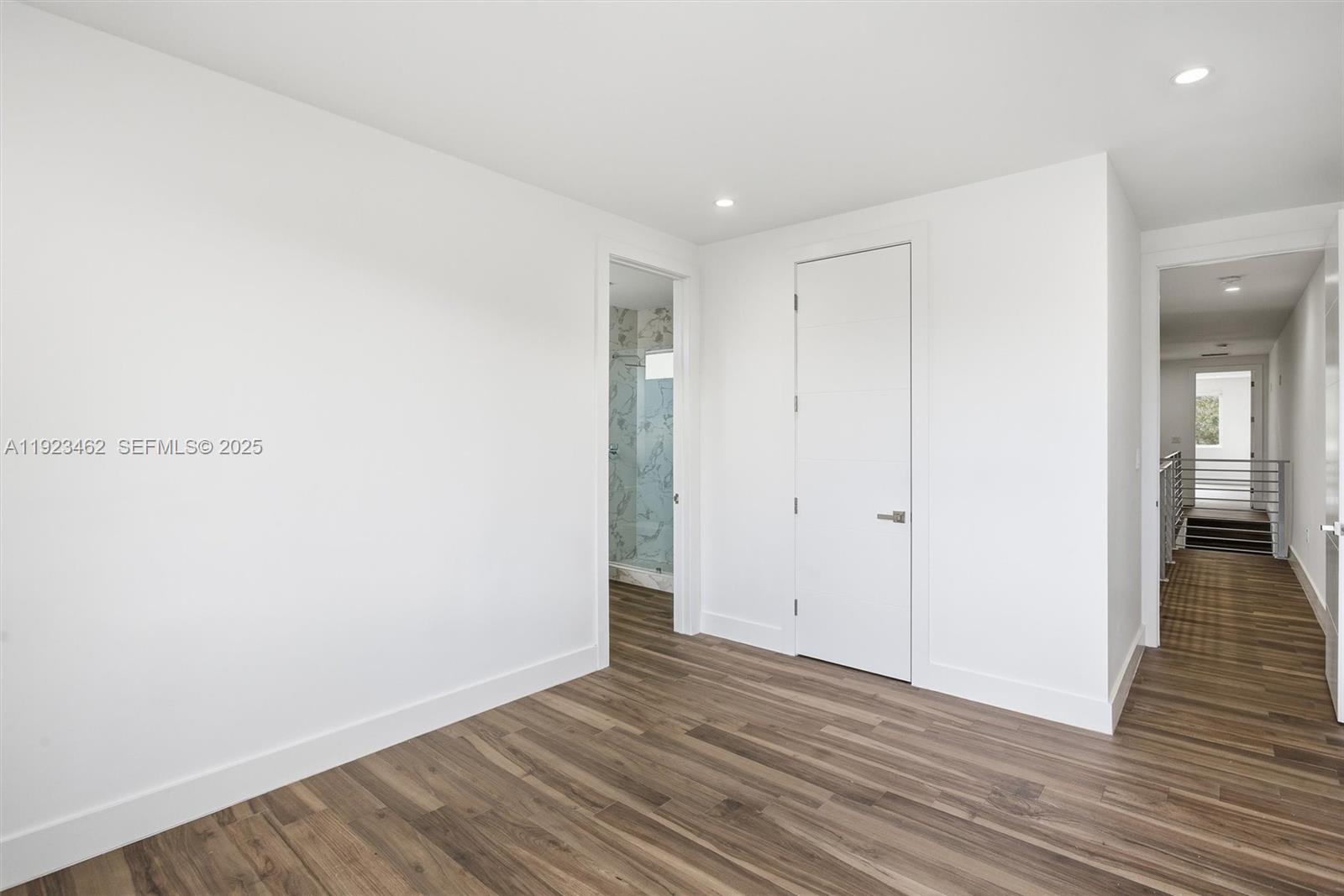 2852 Southwest 32nd Court, Unit 2852 Miami, FL 33133 - Photo 39 of 50 a view of an empty room and wooden floor