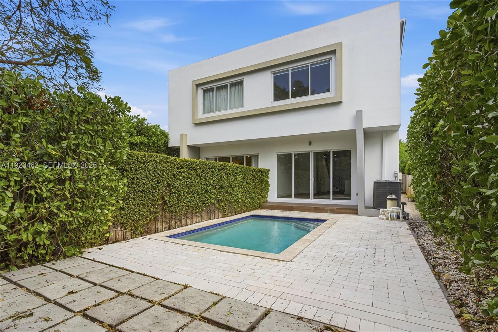 2852 Southwest 32nd Court, Unit 2852 Miami, FL 33133 - Photo 7 of 50 a view of a house with a yard
