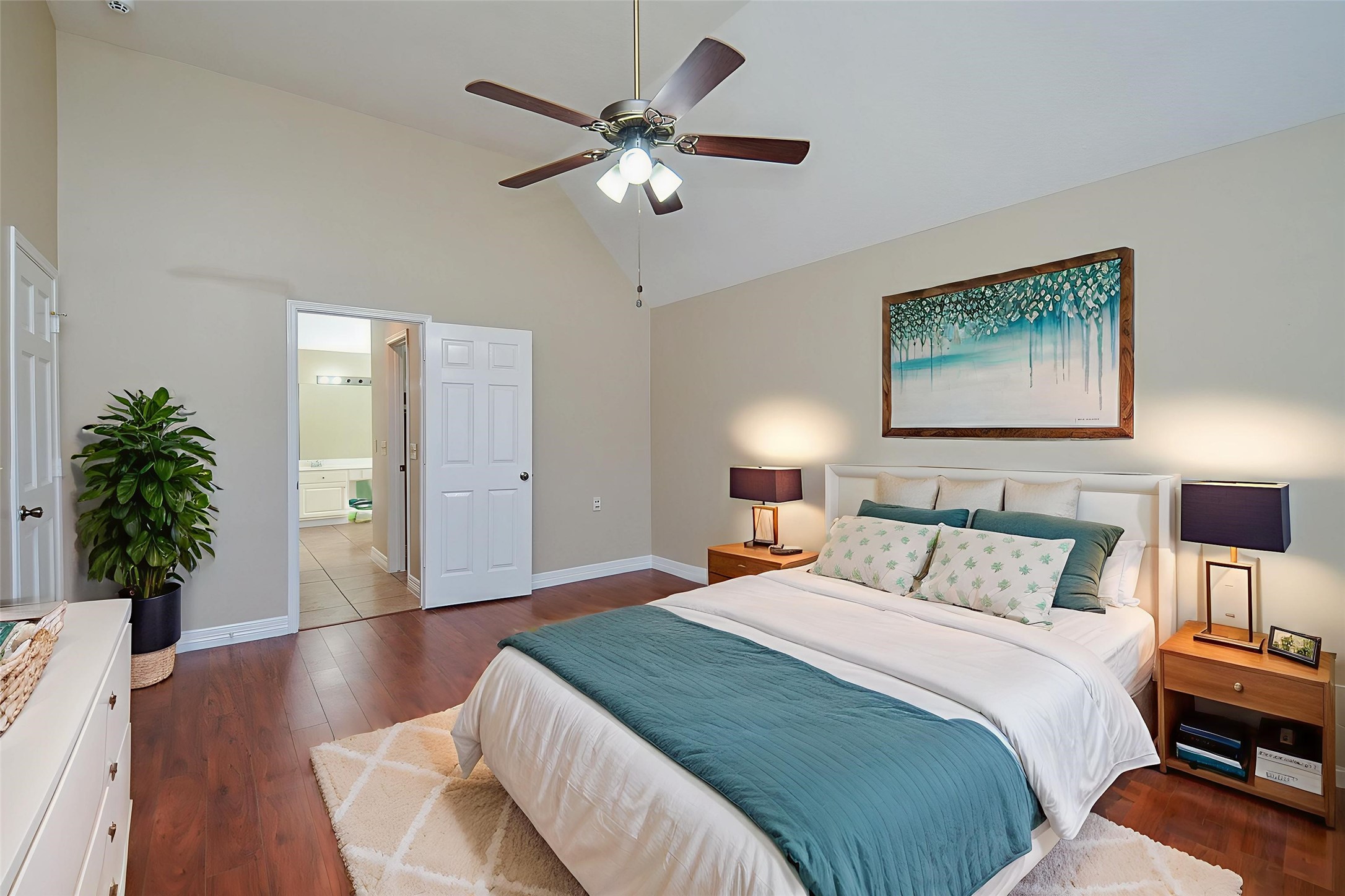8803 Tweedbrook Drive Spring, TX 77379 - Photo 17 of 36 The primary bedroom has gorgeous wood flooring throughout and a beautiful ceiling fan to provide comfortable temperatures year-round.