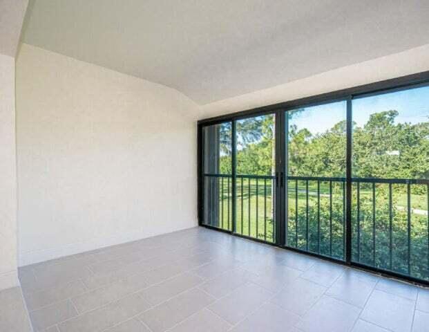 9284 Vista Del Lago, Unit 34F Boca Raton, FL 33428 - Photo 8 of 15 a view of a room with large windows