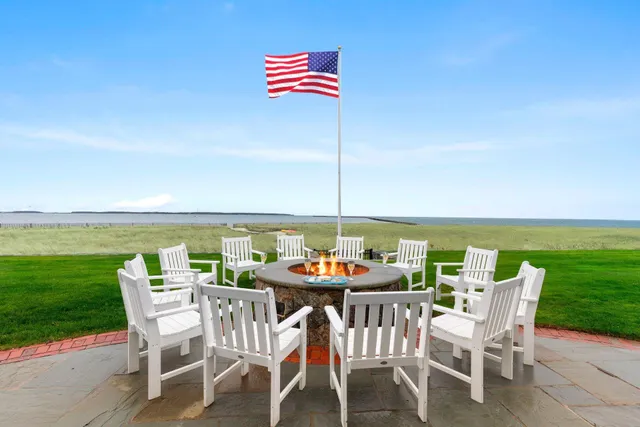a dining room with furniture and garden view