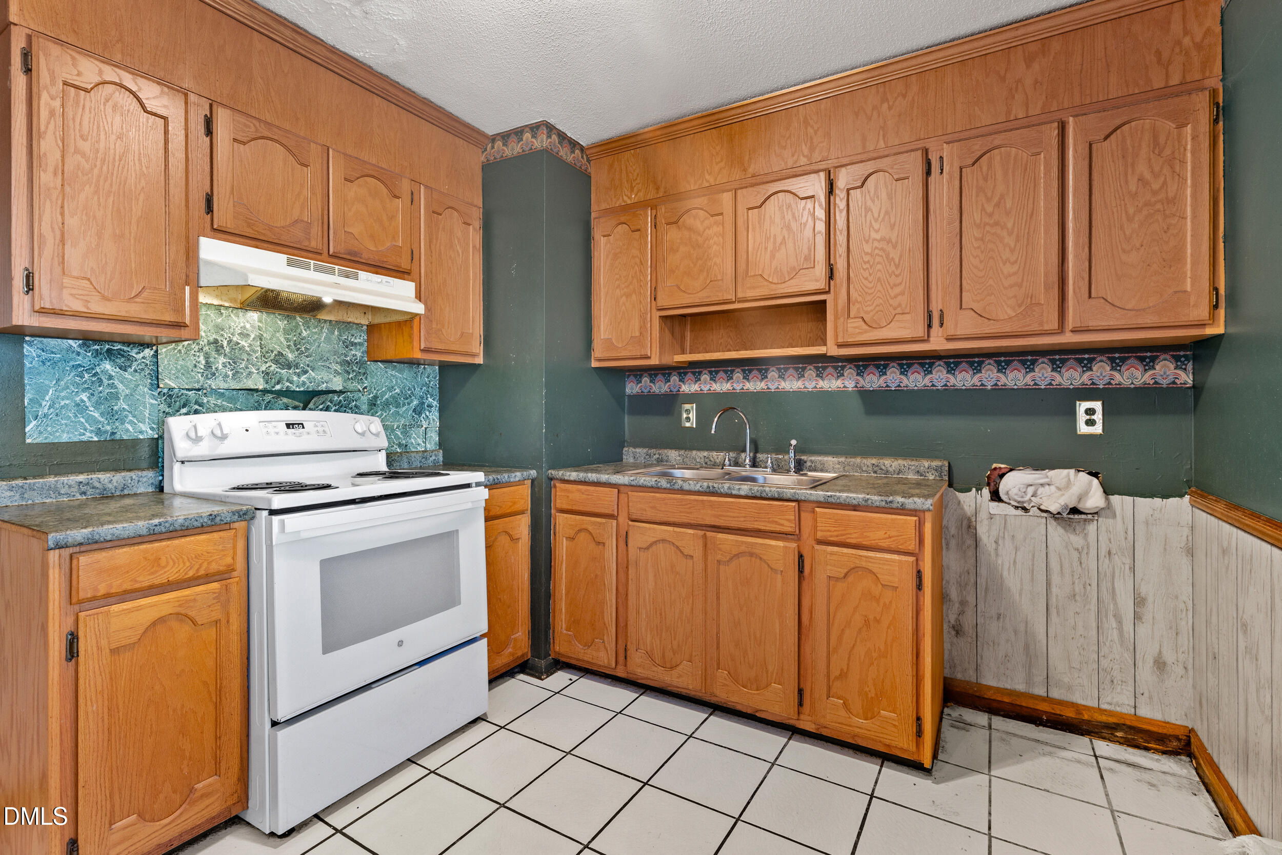 159 Hazel Drive Burlington, NC 27217 - Photo 14 of 21 a kitchen with granite countertop a sink stove and cabinets