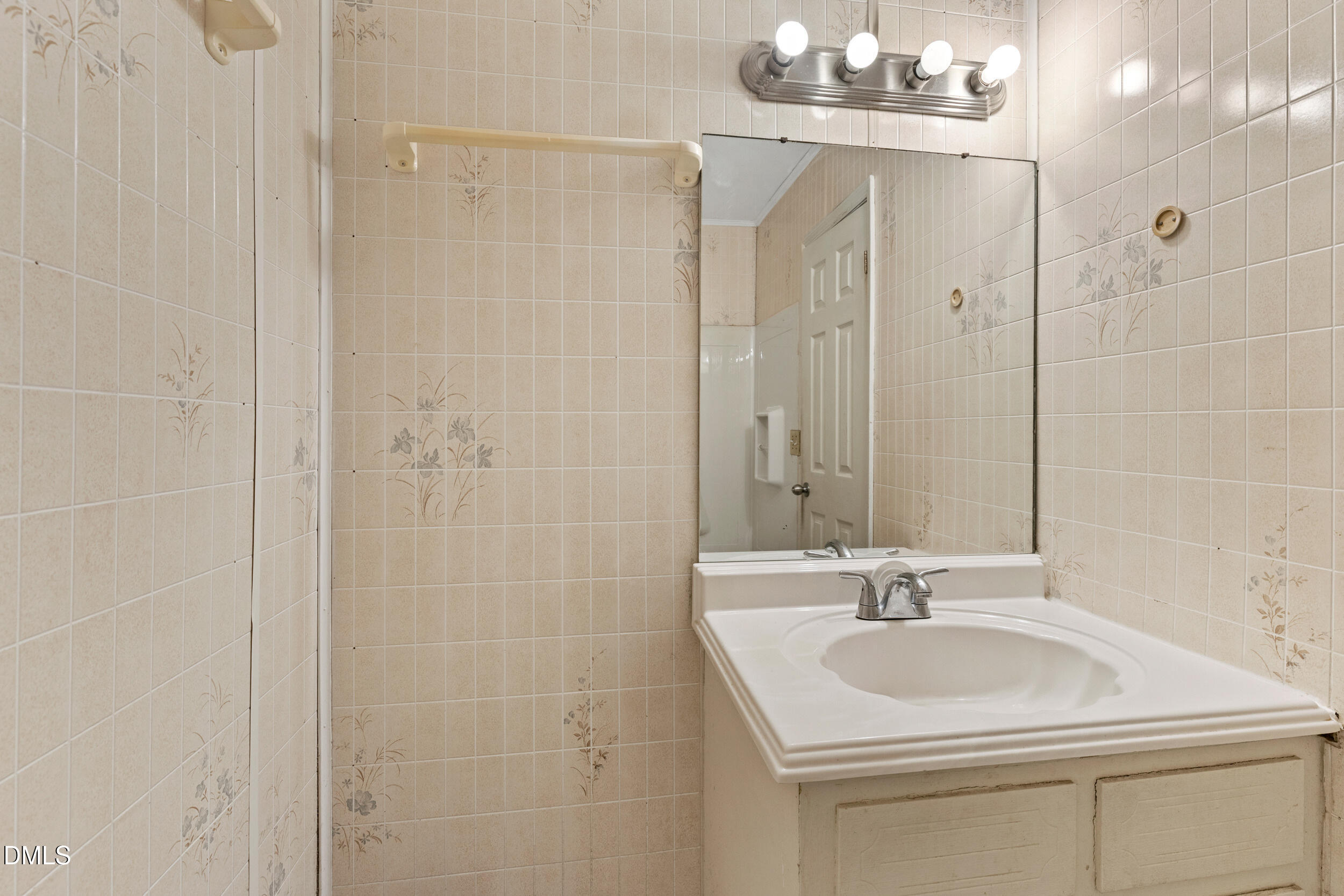 159 Hazel Drive Burlington, NC 27217 - Photo 20 of 21 a bathroom with a sink a vanity a shower and a mirror