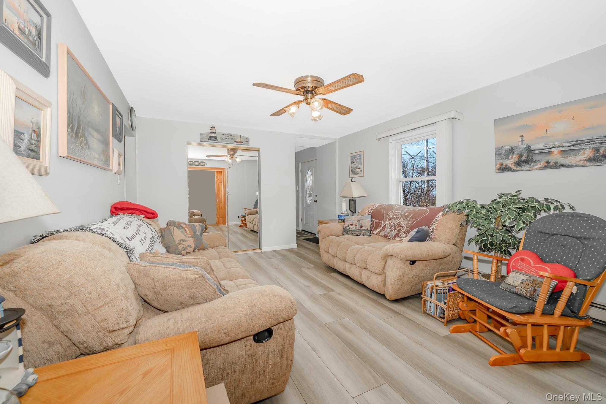 3683 Hawk Road Levittown, NY 11756 - Photo 11 of 41 a living room with furniture chess board and a couch
