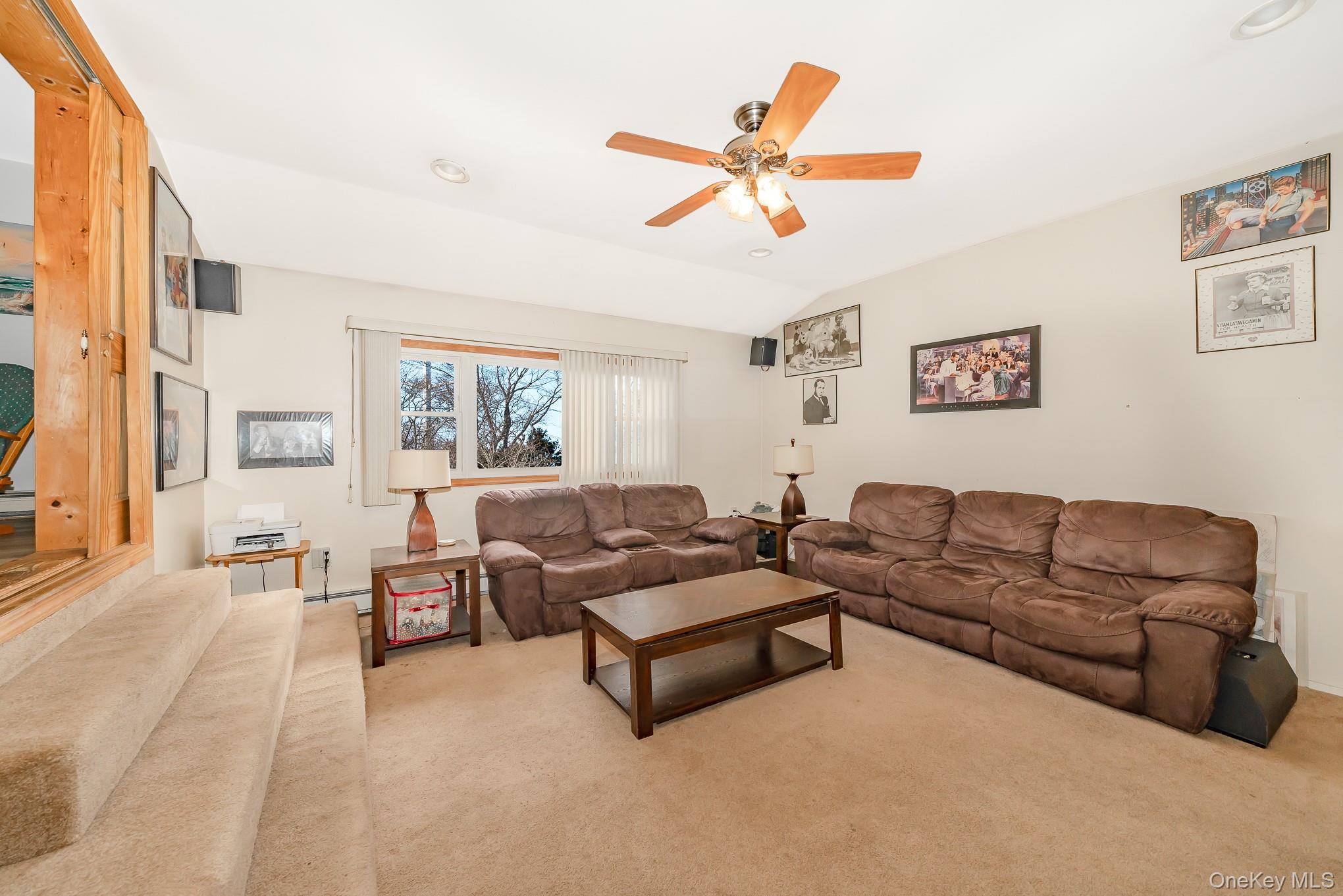 3683 Hawk Road Levittown, NY 11756 - Photo 12 of 41 a living room with furniture and a large window