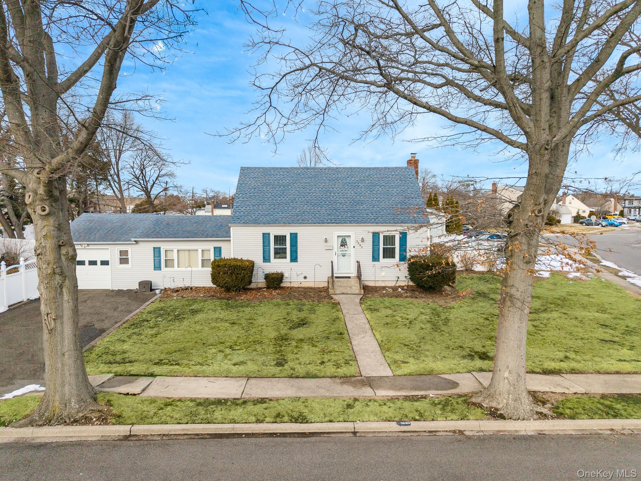 3683 Hawk Road Levittown, NY 11756 - Photo 26 of 41 front view of a house with a yard