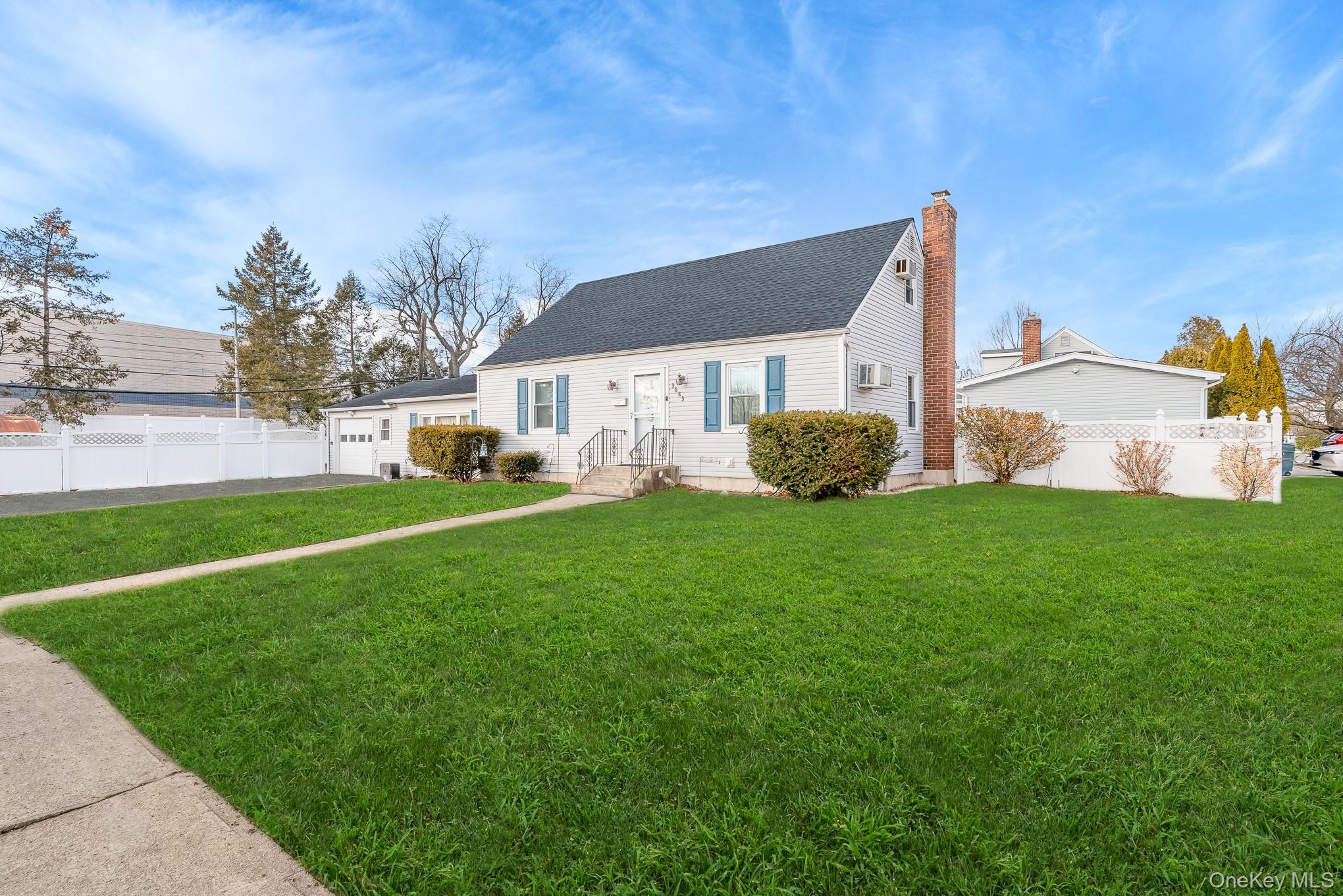 3683 Hawk Road Levittown, NY 11756 - Photo 3 of 41 a front view of a house with garden