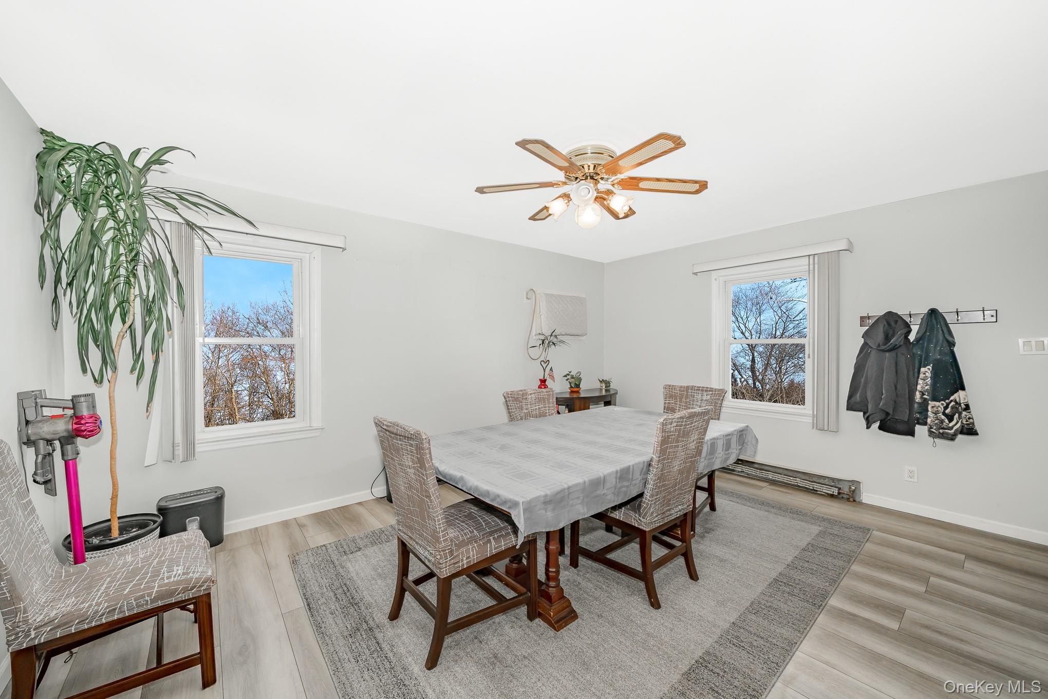 3683 Hawk Road Levittown, NY 11756 - Photo 9 of 41 a view of a workspace with furniture and wooden floor