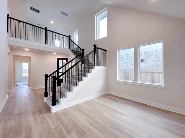 a work room with furniture and a potted plant