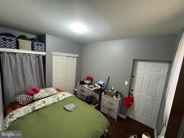 a bedroom with bed and a window