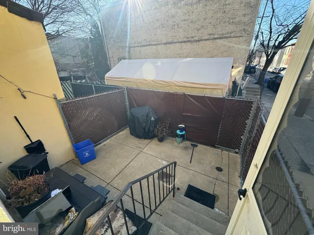 a view of balcony with wooden floor and seating space