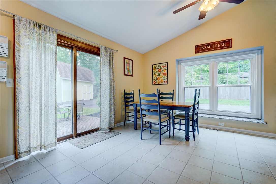 1990 Penfield Road Penfield, NY 14526 - Photo 19 of 44 Sliding door leads to patio! Custom window seat- i